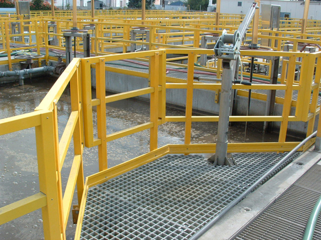 Fiber Glass Reinforced Plastic Corrosion Resistant Molded Grating and Yellow Railing in Wastewater Treatment Facility